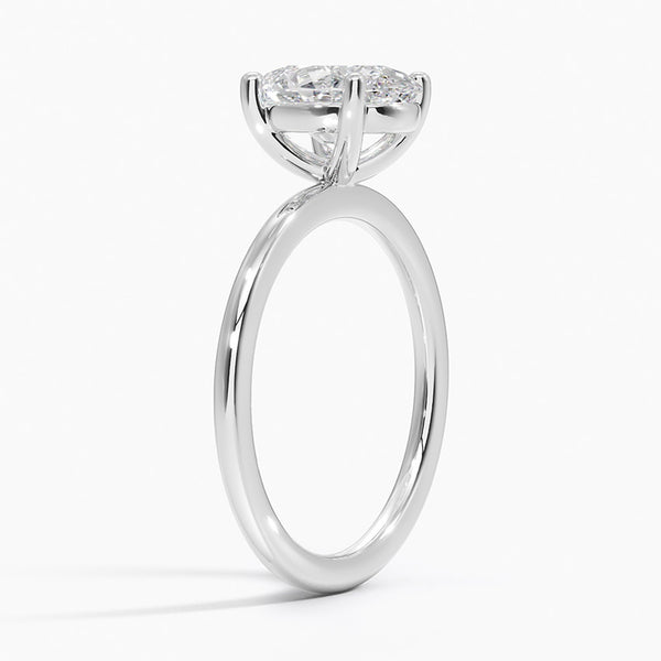 Minimalist elegance at its finest—Celestia Pure features a breathtaking oval diamond in a timeless solitaire setting crafted from polished white metal.