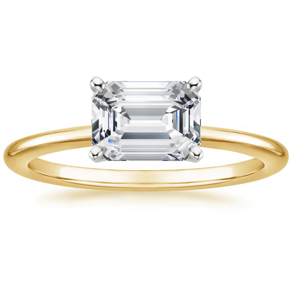 Solstice Grace is a minimalist masterpiece, showcasing an emerald-cut diamond in a classic four-prong setting with a smooth, polished band that radiates refined simplicity.