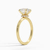 A round brilliant solitaire embraced by an intricate vine-inspired setting, intertwining elegance and organic artistry.