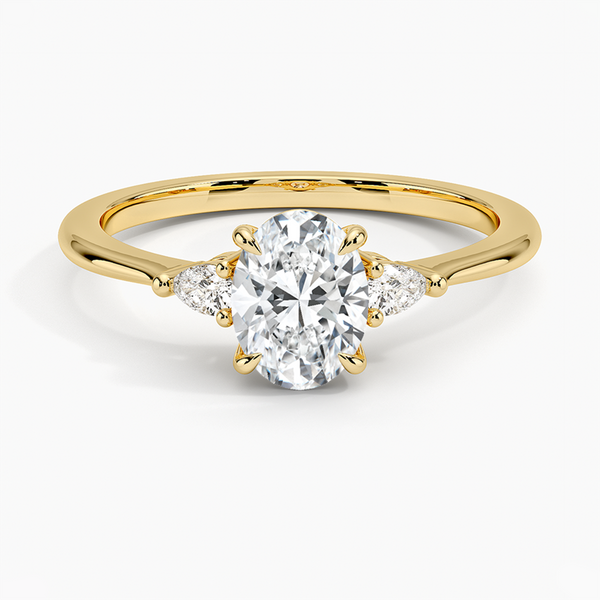 An elegant three-stone ring featuring a radiant oval center gem embraced by soft pear-cut side stones.