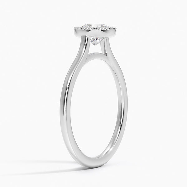 Liora Crest captures the essence of modern grace, featuring a sculptural split-shank design and a bezel-style crown accented with fine milgrain.