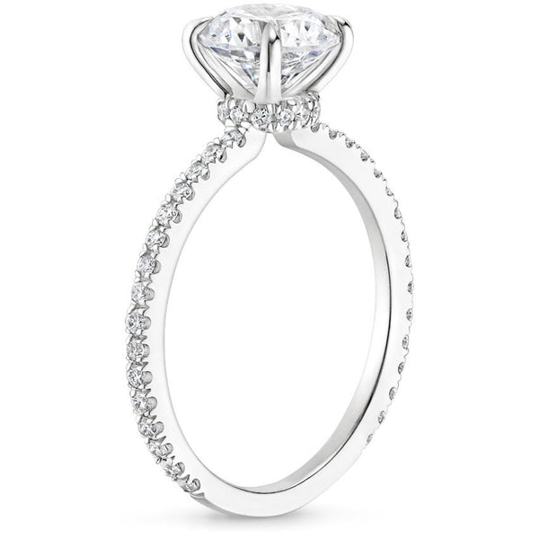 “Elevate your love with this dazzling round-cut diamond ring, featuring a sparkling pavé band crafted for timeless elegance and unforgettable brilliance.”