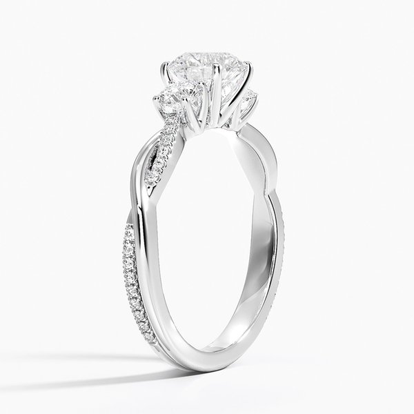 A radiant masterpiece with a floral-inspired setting and pavé diamond details that dazzle from every angle.
