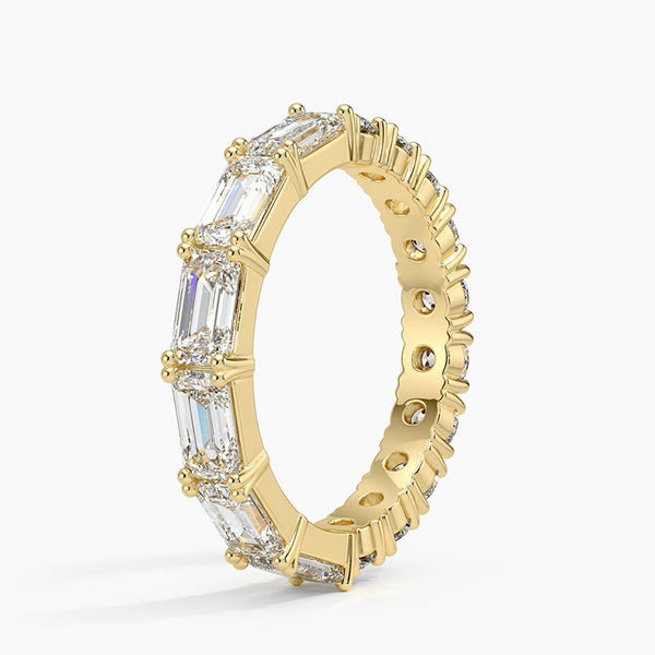 “Radiate elegance with this luxurious mixed-shape diamond eternity ring, crafted in gleaming yellow gold for timeless sparkle, brilliance, and unmatched style.”