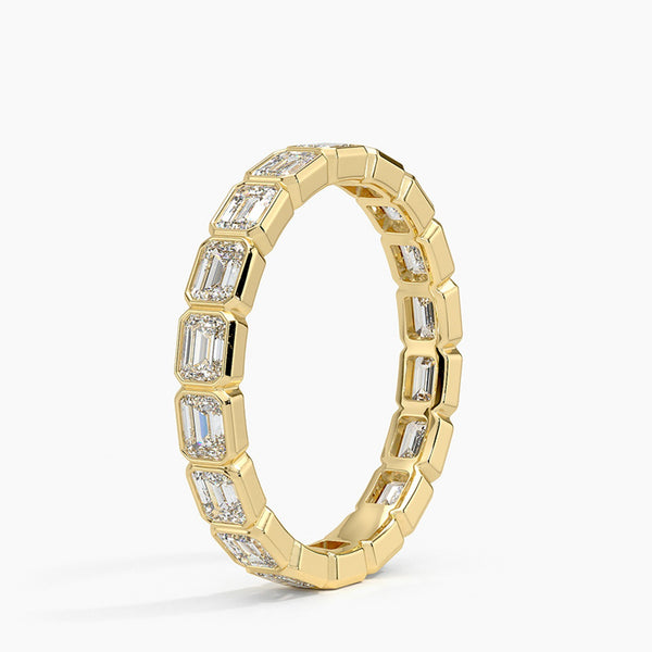 “Elevate your elegance with this emerald-cut diamond eternity ring, showcasing timeless brilliance, luxurious craftsmanship, and radiant gold sophistication for every occasion.”
