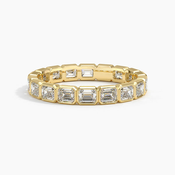 “Elevate your elegance with this emerald-cut diamond eternity ring, showcasing timeless brilliance, luxurious craftsmanship, and radiant gold sophistication for every occasion.”