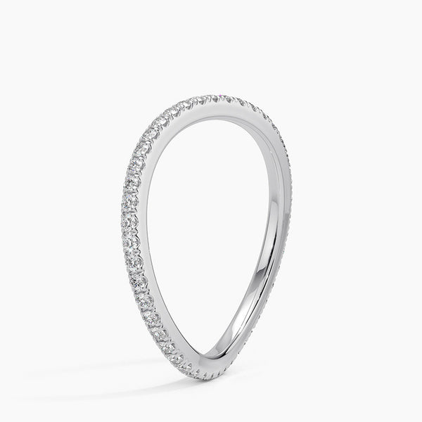 “Elegant curved diamond band crafted in luxurious yellow gold, offering a perfect stackable wedding ring with timeless sparkle and modern sophistication.”