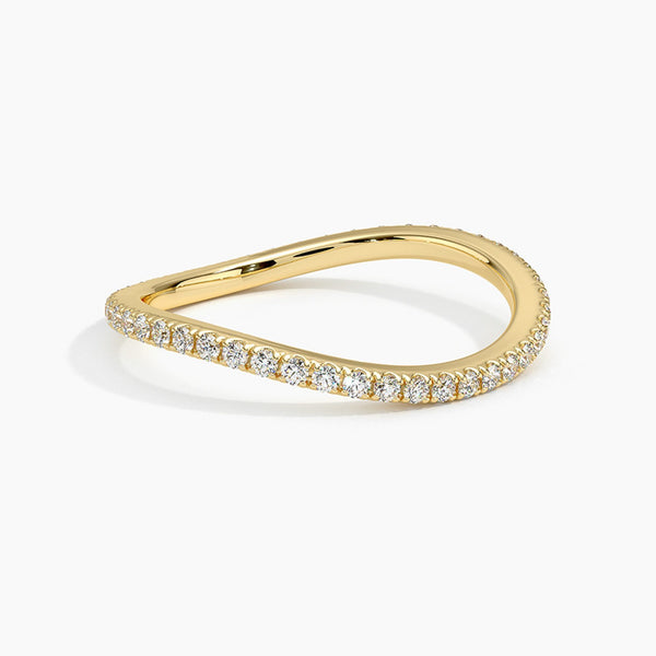 “Elegant curved diamond band crafted in luxurious yellow gold, offering a perfect stackable wedding ring with timeless sparkle and modern sophistication.”
