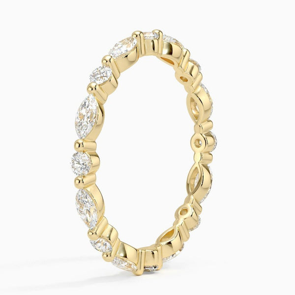 “Elevate your elegance with this marquise and round diamond eternity ring, crafted in luxe yellow gold for timeless sparkle and lasting brilliance.”