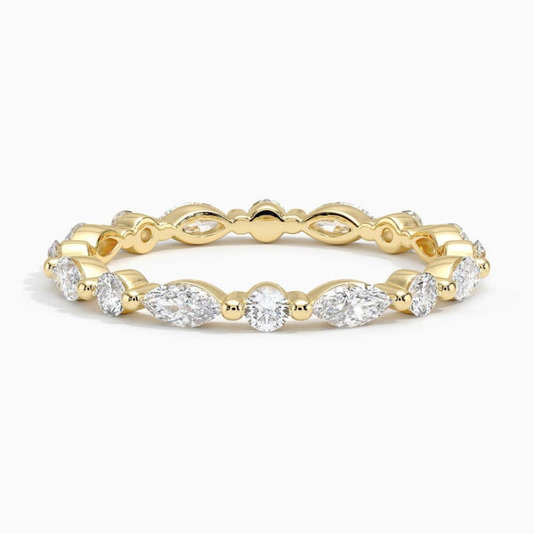 “Elevate your elegance with this marquise and round diamond eternity ring, crafted in luxe yellow gold for timeless sparkle and lasting brilliance.”