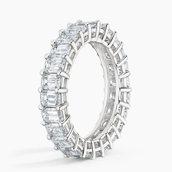 “Luxurious emerald-cut diamond eternity band in radiant yellow gold, delivering bold brilliance, timeless elegance, and unmatched sparkle for unforgettable everyday sophistication.”