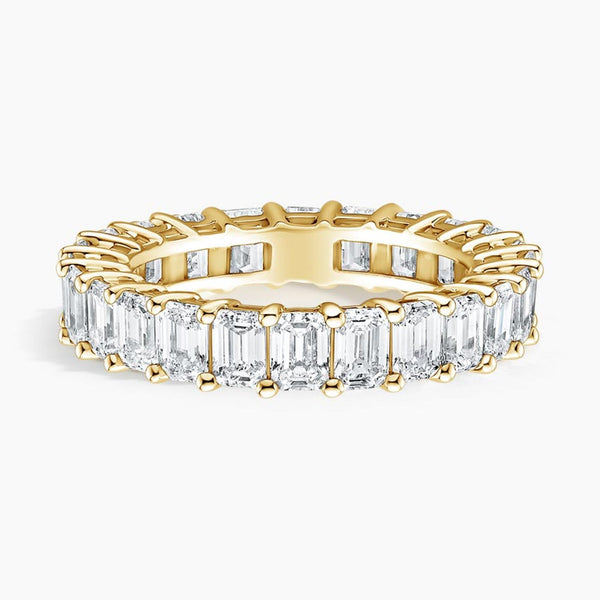 “Luxurious emerald-cut diamond eternity band in radiant yellow gold, delivering bold brilliance, timeless elegance, and unmatched sparkle for unforgettable everyday sophistication.”