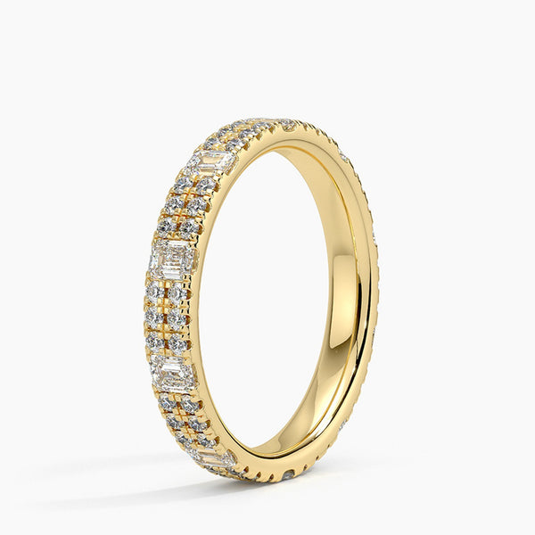 Radiate timeless elegance with this yellow-gold diamond band, featuring brilliant round and baguette stones for a luxurious, sparkling statement of everlasting love.