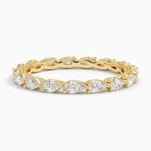“Elegant pear-shaped diamond eternity ring in yellow gold, crafted for timeless brilliance, luxurious sparkle, and perfect everyday or bridal elegance.”