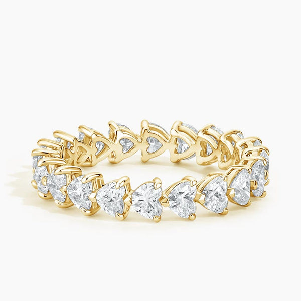 “Celebrate endless love with this heart-shaped diamond eternity ring, crafted in glowing yellow gold for timeless brilliance and romantic luxury.”