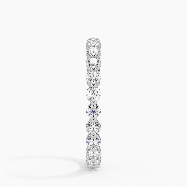 “Elegant diamond eternity ring crafted in shimmering white metal, showcasing brilliant round stones for timeless sparkle, luxury style, and lasting sophistication.”