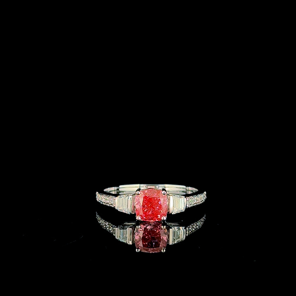 cushion-cut pink diamond three-stone ring with baguette sides and pavé band. (1.38 ct. tw.) White Gold