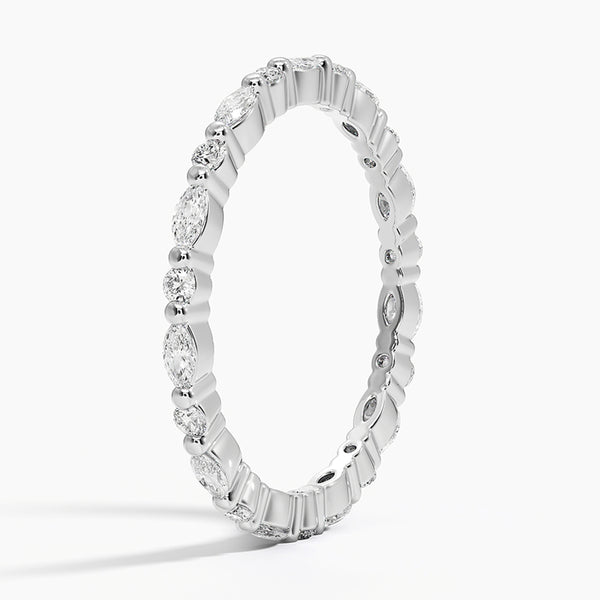 “Elegant diamond eternity band featuring marquise and round stones in sleek white gold, delivering timeless sparkle, refined style, and luxurious brilliance.”