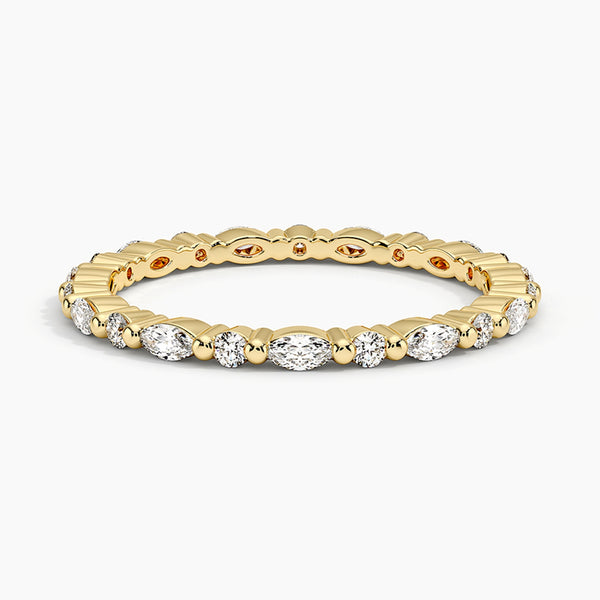 “Elegant diamond eternity band featuring marquise and round stones in sleek white gold, delivering timeless sparkle, refined style, and luxurious brilliance.”