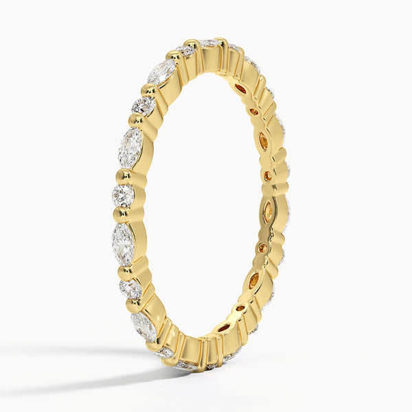 “Elegant diamond eternity band featuring marquise and round stones in sleek white gold, delivering timeless sparkle, refined style, and luxurious brilliance.”