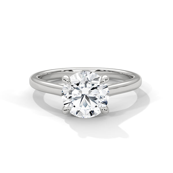 “Aurora Ring—round brilliant diamond sparkle, classic six-prong elegance, and timeless solitaire beauty crafted to symbolize enduring love, refined style, and radiant grace.”