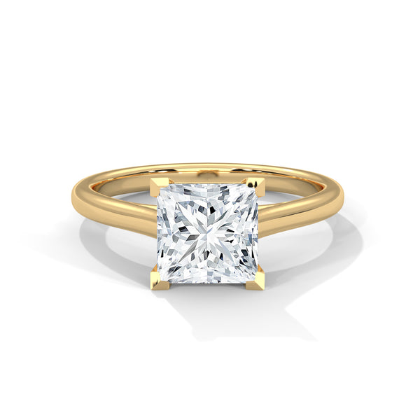 “Luna Ring—princess-cut diamond brilliance, minimalist four-prong elegance, and timeless solitaire beauty crafted to symbolize pure love, modern simplicity, and lasting sophistication.”
