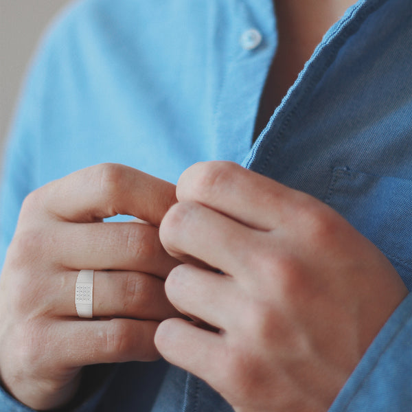 “Bold gold men’s diamond ring showcasing a sleek grooved band and radiant square diamond cluster, crafted for luxury, style, and everyday elegance.”