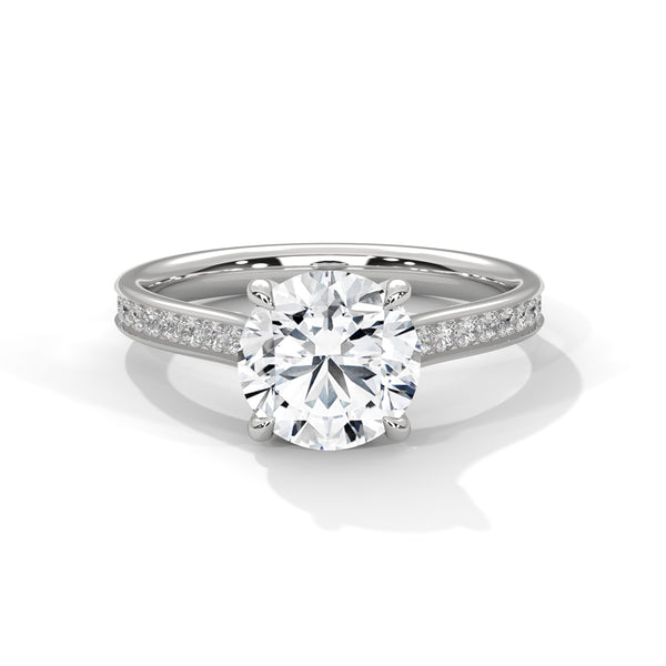 “Luna Ring—round-cut diamond brilliance, split-shank pavé elegance, and modern white-gold luxury crafted to symbolize timeless love, radiant beauty, and unforgettable moments.”