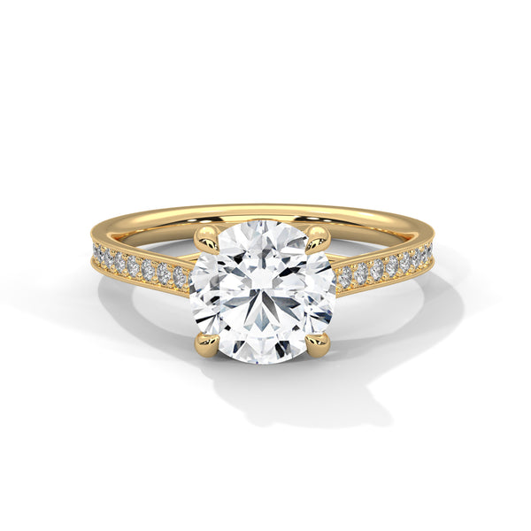 “Aurora Ring—round brilliant diamond sparkle, sleek pavé-band elegance, and timeless white-gold beauty crafted to symbolize radiant love, grace, and unforgettable moments.”