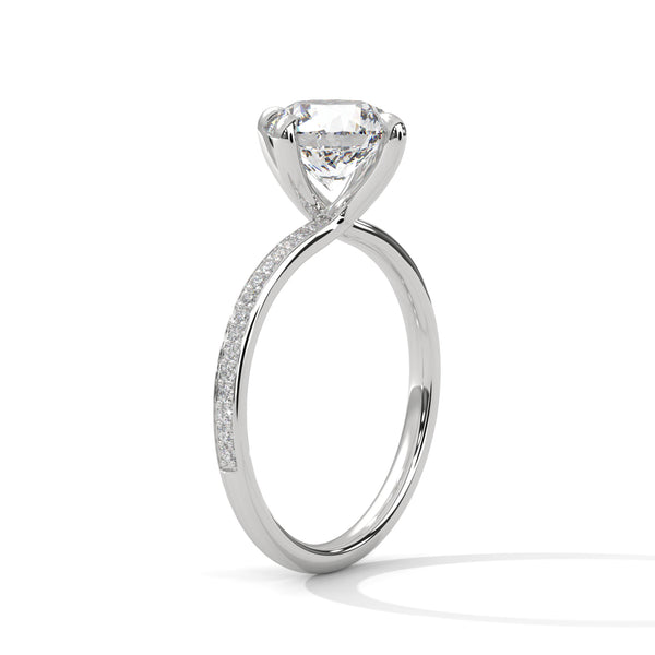 “Celeste Ring—round brilliant diamond beauty, four-prong tulip elegance, and refined pavé sparkle crafted to symbolize timeless love, radiant grace, and everlasting sophistication.”