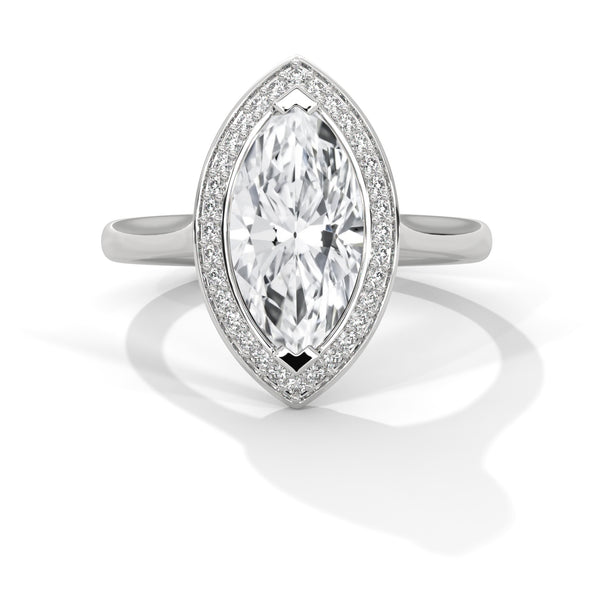 “Solara Ring—marquise-cut brilliance, sleek bezel halo, and bold modern elegance crafted to symbolize timeless love, radiant beauty, and unforgettable moments.”