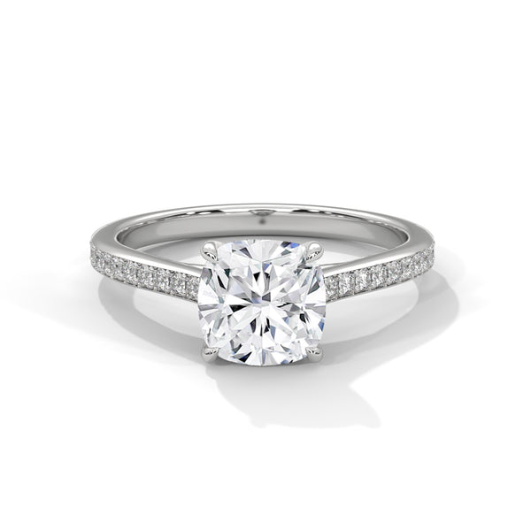 “Cushion-cut diamond solitaire ring in white gold—brilliant sparkle, pavé band elegance,and timeless luxury crafted for everlasting love.”