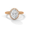 A graceful oval-cut lab-grown diamond encircled by a shimmering halo — effortless elegance with eye-catching brilliance