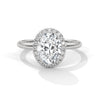 A graceful oval-cut lab-grown diamond encircled by a shimmering halo — effortless elegance with eye-catching brilliance