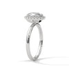 A graceful oval-cut lab-grown diamond encircled by a shimmering halo — effortless elegance with eye-catching brilliance