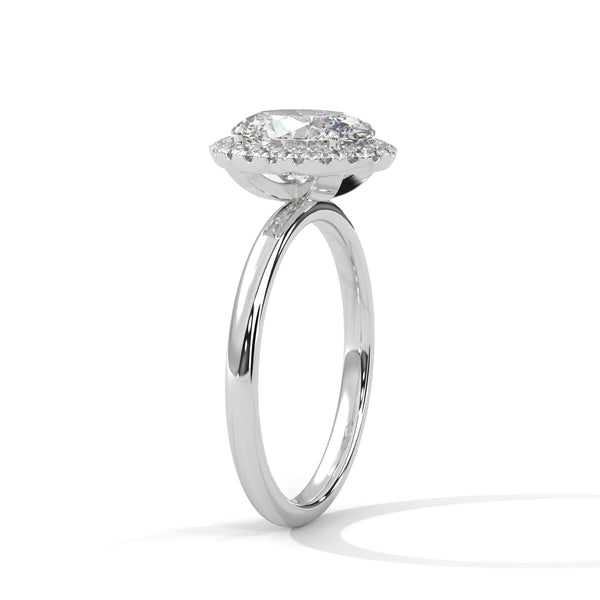 A graceful oval-cut lab-grown diamond encircled by a shimmering halo — effortless elegance with eye-catching brilliance