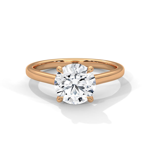“Celeste Ring—round brilliant diamond sparkle, minimalist four-prong solitaire elegance, and timeless white-gold beauty crafted to symbolize pure love and lasting sophistication.”