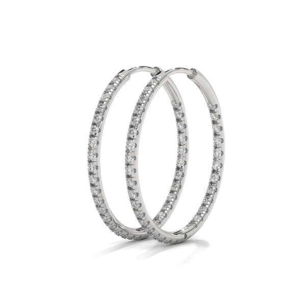 Classic hoops reimagined with a luminous row of diamonds—endless style, infinite sparkle.