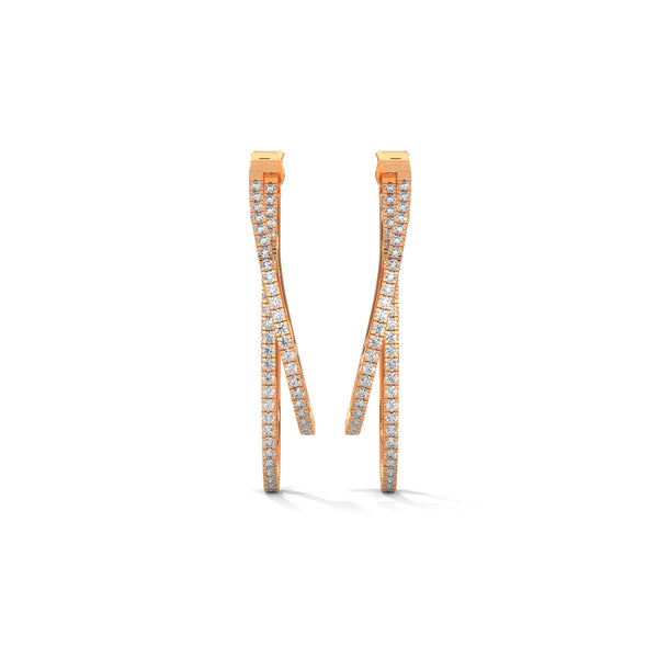 Stylishly layered gold hoops, adorned with sparkling diamonds for a bold yet elegant statement.