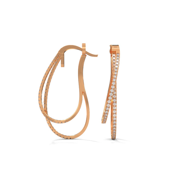 Stylishly layered gold hoops, adorned with sparkling diamonds for a bold yet elegant statement.