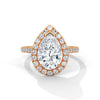 “Pear-shaped diamond halo ring in rosegold—radiant brilliance, pavé-band sparkle, andluxurious elegance crafted for timeless love andunforgettable moments.”