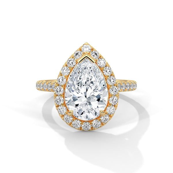 “Pear-shaped diamond halo ring in rosegold—radiant brilliance, pavé-band sparkle, andluxurious elegance crafted for timeless love andunforgettable moments.”