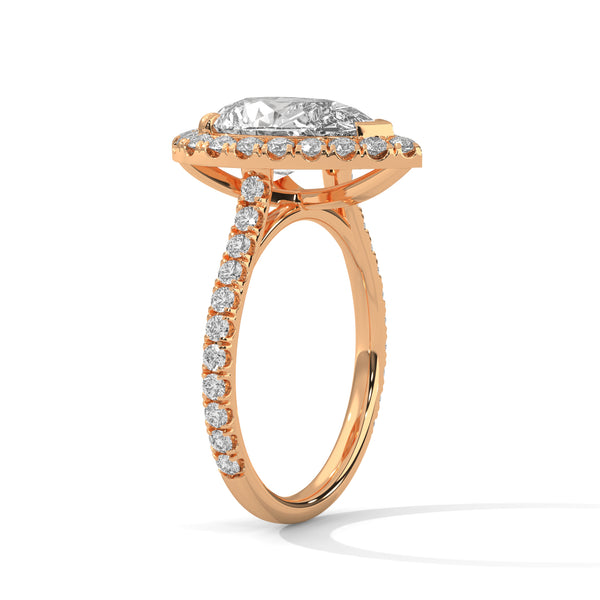 “Pear-shaped diamond halo ring in rosegold—radiant brilliance, pavé-band sparkle, andluxurious elegance crafted for timeless love andunforgettable moments.”