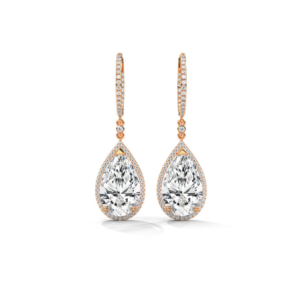 Dramatic rose gold danglers with pear-shaped centerpieces and a cascade of diamonds for breathtaking brilliance.