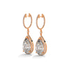 Dramatic rose gold danglers with pear-shaped centerpieces and a cascade of diamonds for breathtaking brilliance.