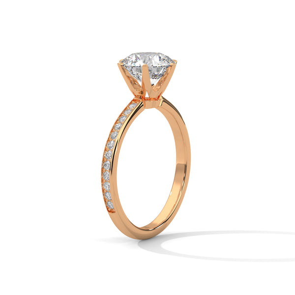 “Radiate brilliance with this rose gold round-cut diamond ring, featuring pavé detailing and timeless elegance for the perfect engagement statement.”