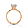 “Radiate brilliance with this rose gold round-cut diamond ring, featuring pavé detailing and timeless elegance for the perfect engagement statement.”