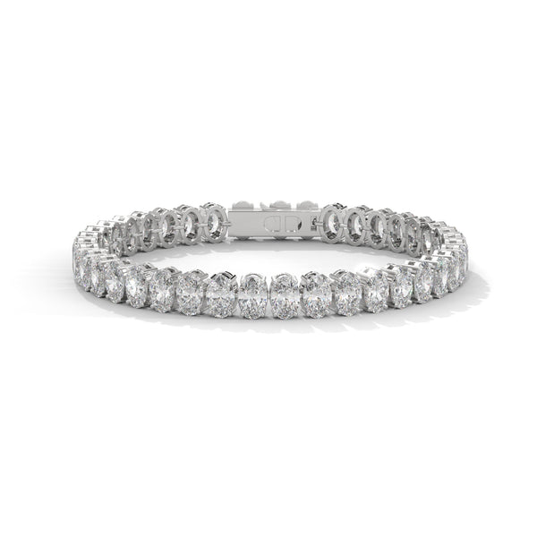 This graceful bangle bracelet features 36 round-shaped diamonds, totaling 0.76 carats, offering a subtle yet sophisticated touch of brilliance. Its 7-inch length ensures a comfortable and perfect fit.