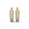 Bold gold hoop earrings encrusted with brilliant pavé diamonds and crowned with fierce panther heads.