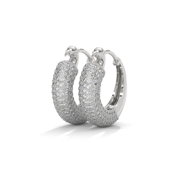 Bold gold hoop earrings encrusted with brilliant pavé diamonds and crowned with fierce panther heads.